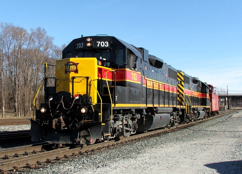 703 and 721 return from Rivderdale as a light caboose hop to Evans Yd. 03-19-06