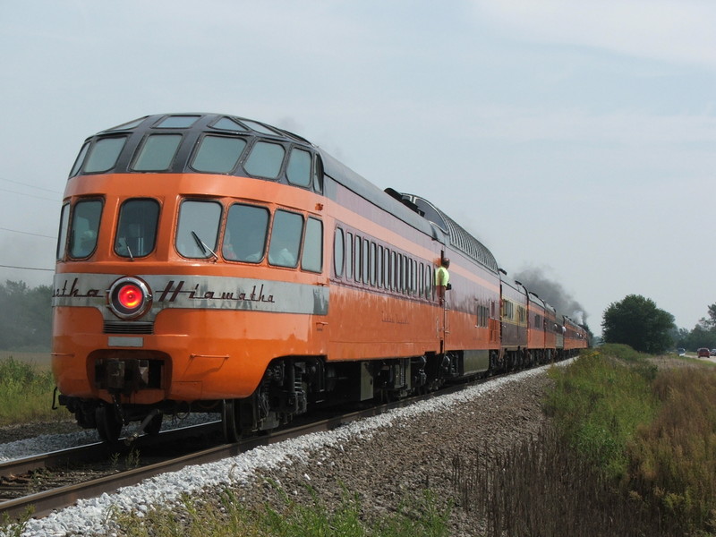 The Hiawatha "Cedar Rapids" brings u pthe rear of the Waterway Special as the train bears down on Wyanet just out of Sheffield.