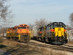 After cutting off their coal train and ducking into the siding, TZPR GP10 3000 and IMRR SD18 61 head down to tie on and drag the coal train across the river.