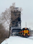 A rebuilt former LLPX GP38-2, 705, leads a pair of GP38AC's on the daily eastbound CBBI through CSX's Bridge 407 after a fresh coat of snow. 01-09-05