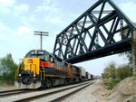 Another pair, this time Iowa 708 and 713, lead the west bound under the old Wabash bridge in New Lenox. At the time, They hadn't even begun construction on extending the Metra line this far west on the NS. 05-08-05