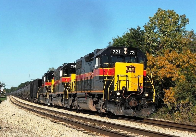 The clean trio thunder around the bend in New Lenox with a ethanol train for the NS. 10-16-05