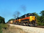 703 leads a BICB through the Oak Forest preserve, between the towns of Oak Forest and Tinley Park. Directly behind the power are METX rock cars that will be dropped off at the EJ&E in Joliet for loading. 09-03-05