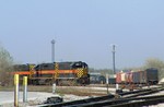 Iowa 626 leads a pair of 700's as they tie onto a cut of intermodel cars after loading, they will proceed to take headroom, tie onto their manifest, build air and rumble westbound. 04-20-05