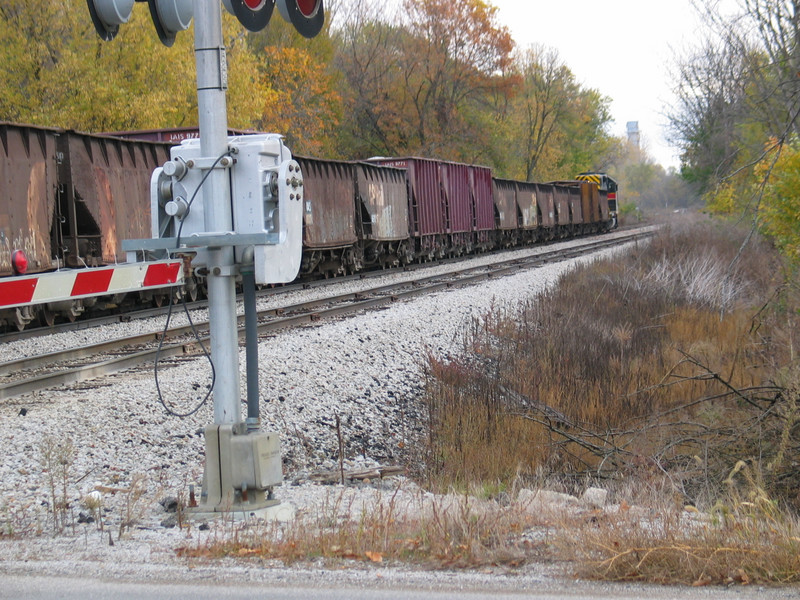 Work 700 takes its ballast train east on N. Star siding, Oct. 24, 2005.