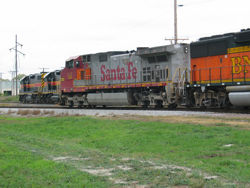 BNSF power heads in at Moline siding, while IAIS 703/713/719 stand by to pick up the train.