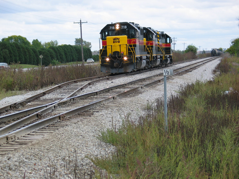 After cutting off their train in the siding, the crew brings the power up to the west switch to run around.