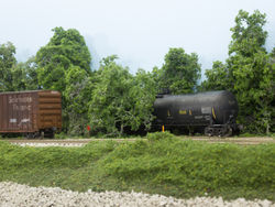 Train DMSW will pickup cars setout by road freights and assemble their train before heading up the Grimes Line. The tank car is spotted on the "Original Grimes Line", the former MILW right of way to Clive.