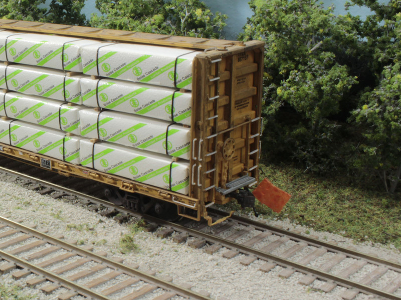 Per prototype practice, flags in safety orange are used for EOT Markers.