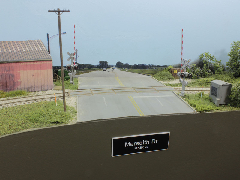 North of the Urbandale runaround, trains will shove across Meredith Drive enroute to Beisser Lumber. Meredith is the only grade crossing with gates for protection. Pallet Recyclers, a non rail-served industry, is located on the north side of the road.