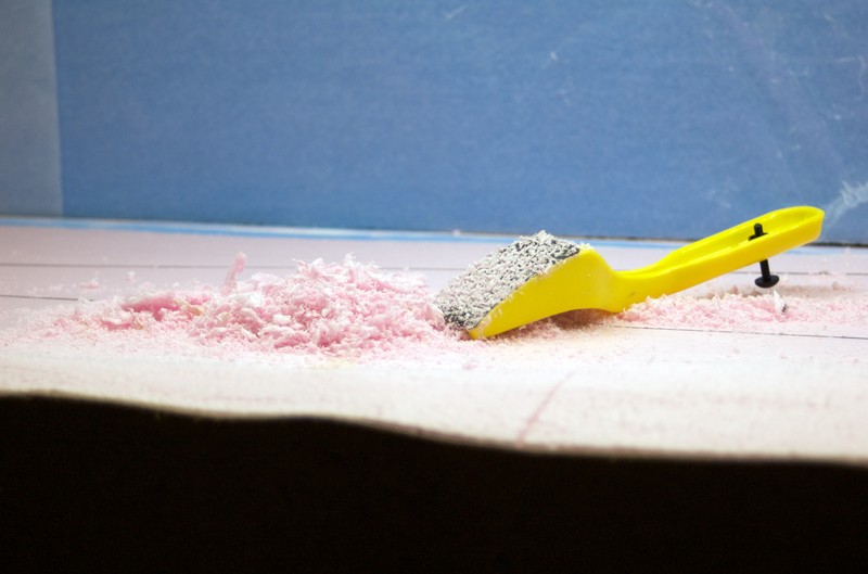 Using foam does create a mess!  A surform tool is used to carve and shave the foam to the desired contour.