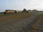 Westbound arrives at N. Star; the crew is going to grab 702 off the siding and take it into Iowa City with them.  The covered hopper is a fertilizer load for Atalissa.  Oct. 27, 2007.