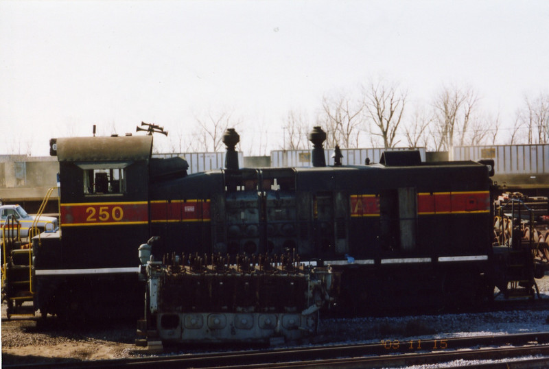 250 at Bluffs, next to a derelict Alco 12 cyl. 251 engine.