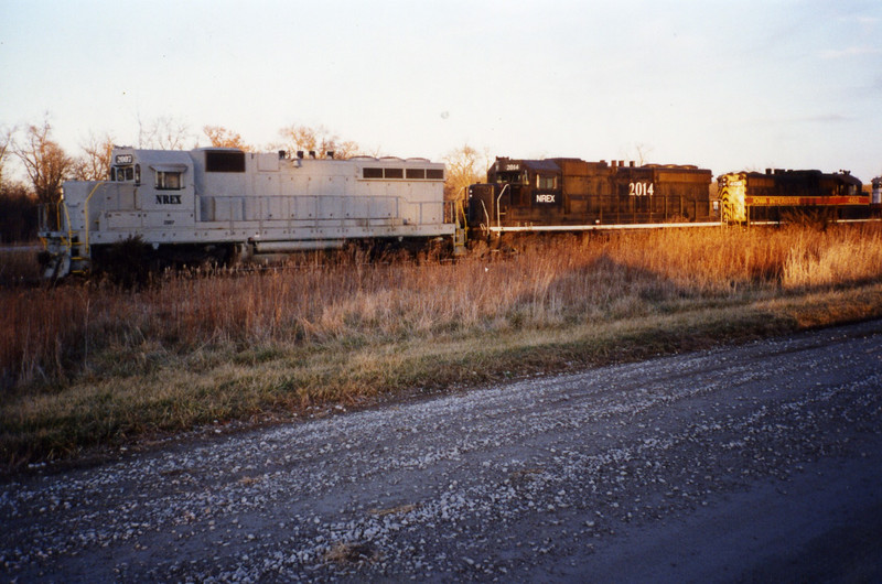 NREX 2007 and 2014 lead a coal train at Homestead, Dec. '95, before they were repainted.