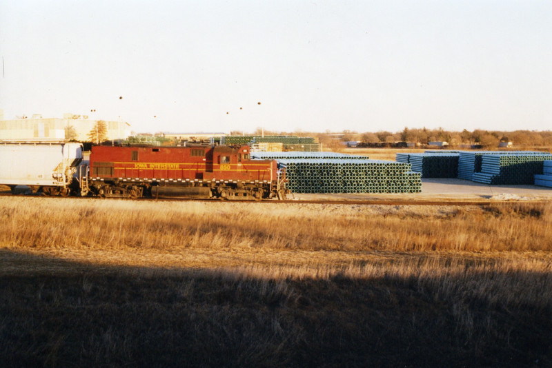 850, heading down the hill past stacks of JM's product, PVC pipe.