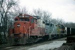 469, 495, and 402 bring a string of empty coal hopper off the CRANDIC into the Iowa City yard. April-1993.