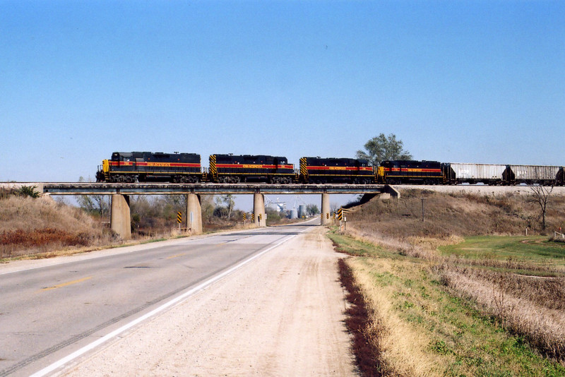 Westbound on the Hancock overpass; lead unit 702 is directly over the former Oakland branch, now used for car storage.  This day there were 8 or 10 HS flats stored there.  Oct. 25, 2005.