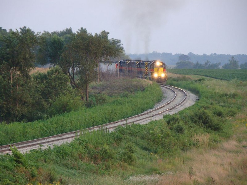 The ICCR crests the hill southwest of Walford, Iowa with NOKL hoppers,  07/26/2008.