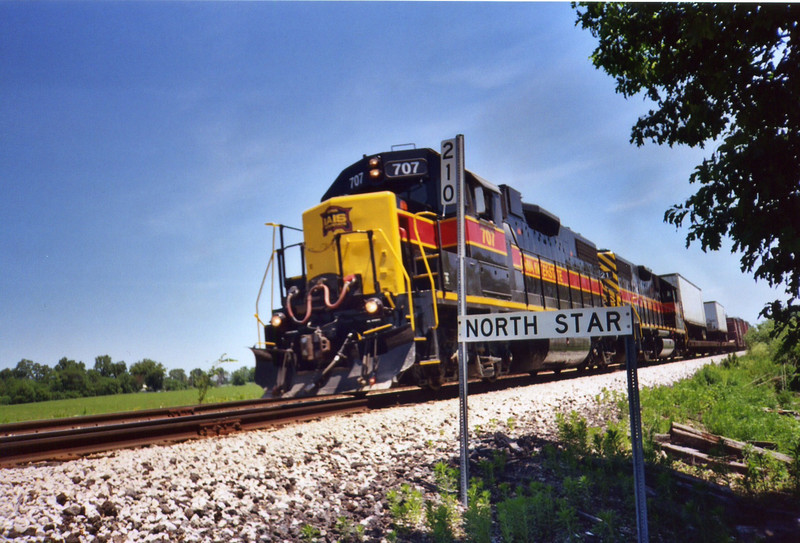 Westbound BICB pulls past the N. Star station sign, June 20, 2005.