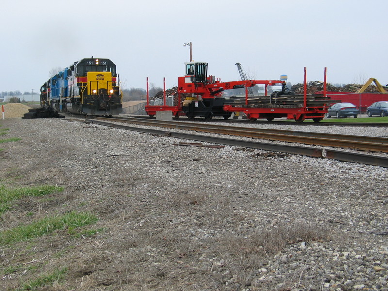 Westbound RI  turn passes an interesting track crane at the Twin States industry track, April 14, 2007.